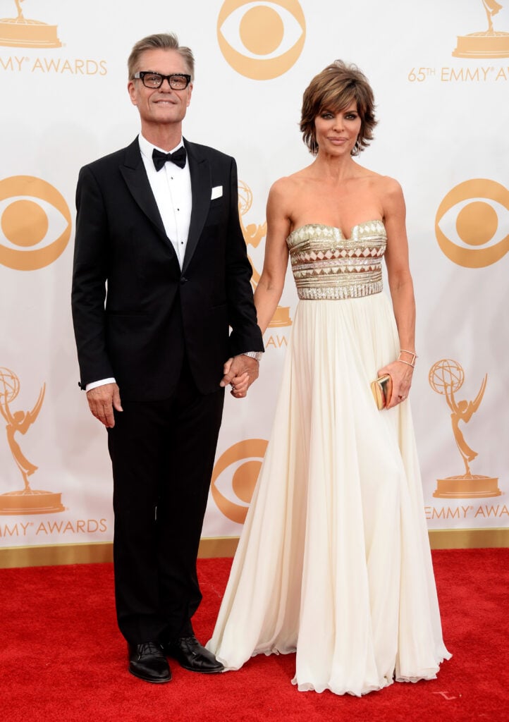 Actors Harry Hamlin and Lisa Rinna arrive at the 65th Annual Primetime Emmy Awards held at Nokia Theatre L.A. Live on September 22, 2013 in Los Angeles, California.  
