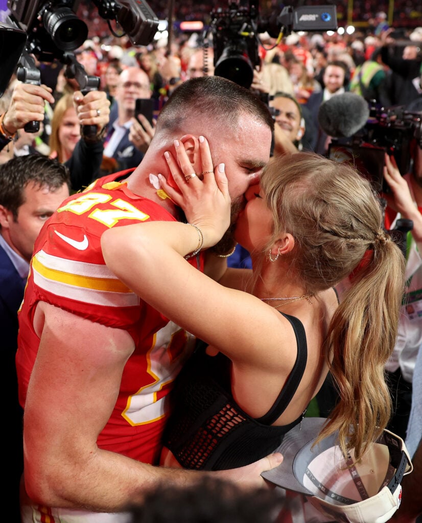 Travis Kelce #87 of the Kansas City Chiefs kisses Taylor Swift after defeating the San Francisco 49ers 25-22 during Super Bowl LVIII at Allegiant Stadium on February 11, 2024 in Las Vegas, Nevada.