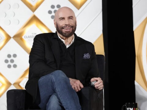 John Travolta speaks onstage at the Opening Night Gala and 30th Anniversary Screening of 