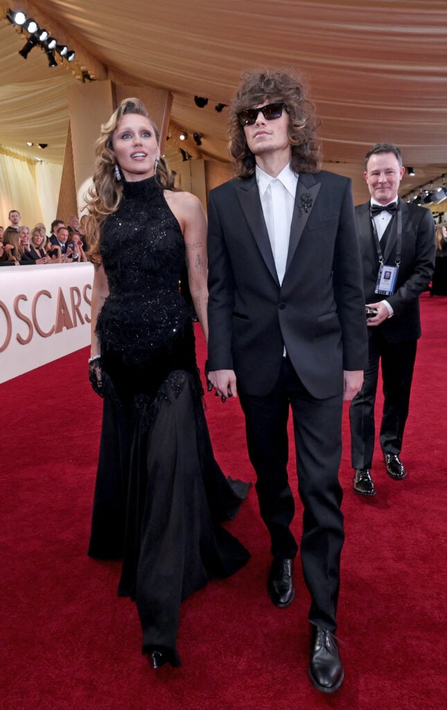US singer Miley Cyrus and Maxx Morando attend the 97th Annual Academy Awards at the Dolby Theatre in Hollywood, California on March 2, 2025.