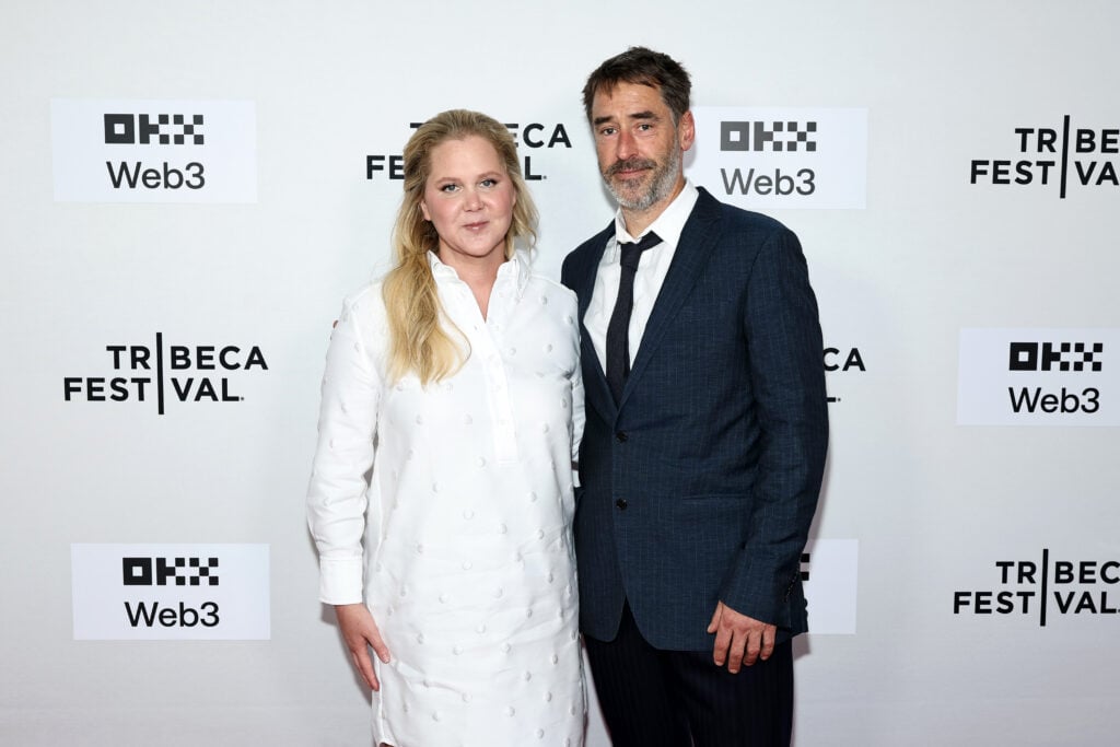Amy Schumer and Chris Fischer attend the "Room To Move" premiere during the 2025 Tribeca Festival at SVA Theater on June 11, 2025 in New York City. 
