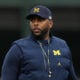 Head coach Sherrone Moore of the Michigan Wolverines looks on prior to the game against the Northwestern Wildcats at Wrigley Field on November 15, 2025 in Chicago, Illinois.