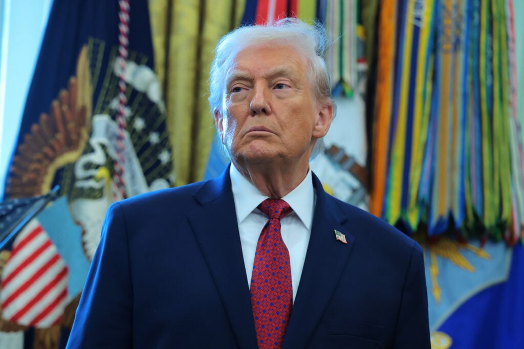 U.S. President Donald Trump listens during a ceremony for the presentation of the Mexican Border Defense Medal in the Oval Office of the White House on December 15, 2025 in Washington, DC. 