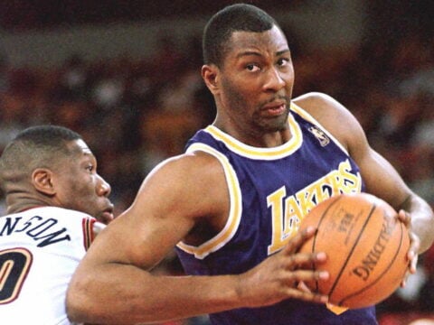 Los Angeles Lakers Elden Campbell shoots around Denver Nuggets Ervin Johnson during first half action of their game 17 March at McNichols Sports Arena in Denver, Co.