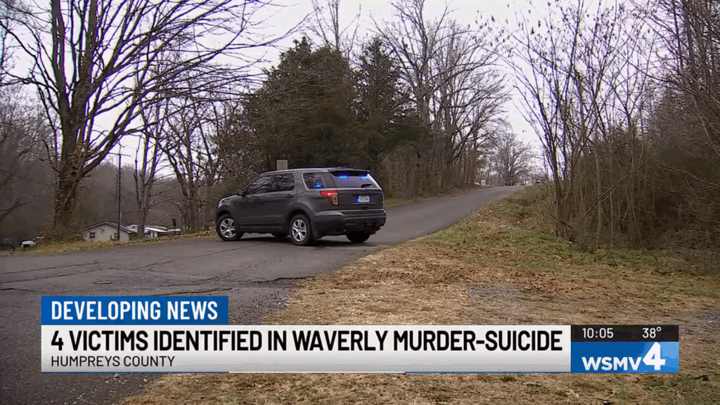 A news screenshot featuring a chyron, police lights.