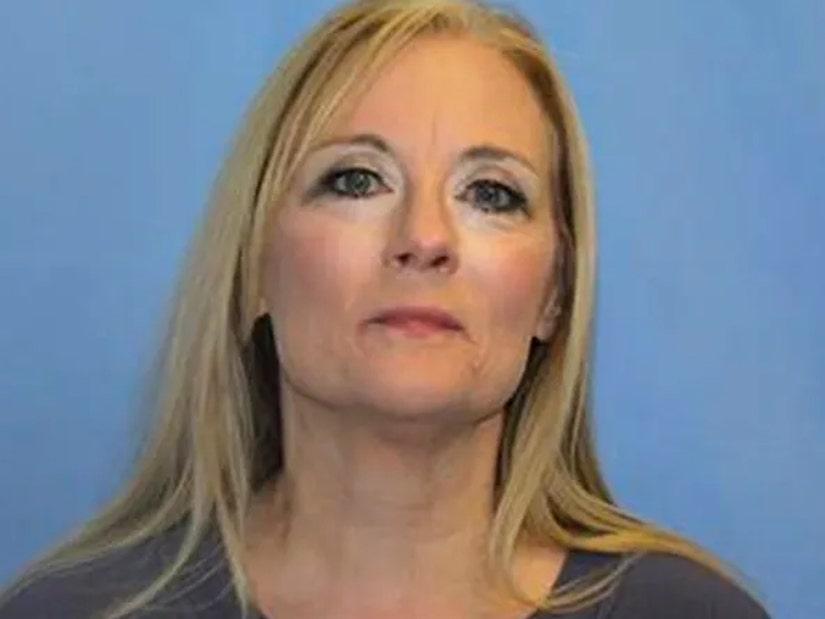 Tamara Hamby with her jail mugshot.