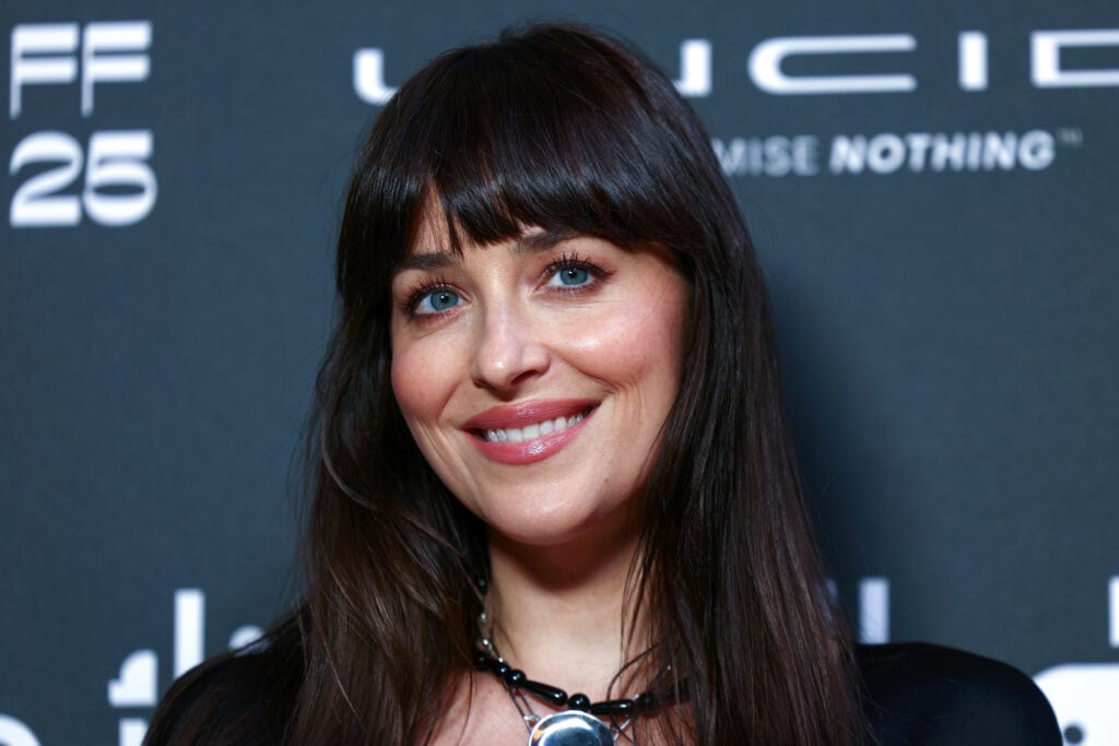 Dakota Johnson in December 2025, smiling.