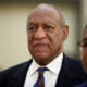 Actor and comedian Bill Cosby returns to the courtroom after a break with his spokesman Andrew Wyatt at the Montgomery County Courthouse, during his sexual assault trial sentencing in Norristown, Pennsylvania, U.S. September 24, 2018.