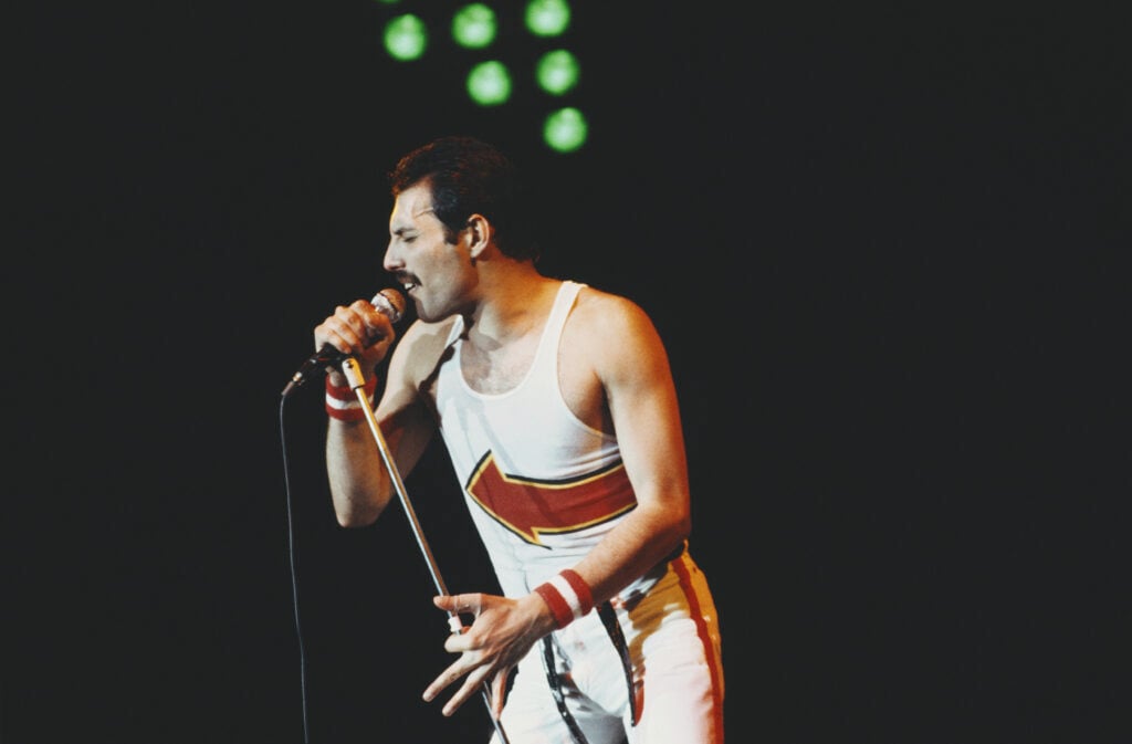 British singer and songwriter Freddie Mercury of rock band Queen performs at Leeds Football Club, England, 29th May 1982.