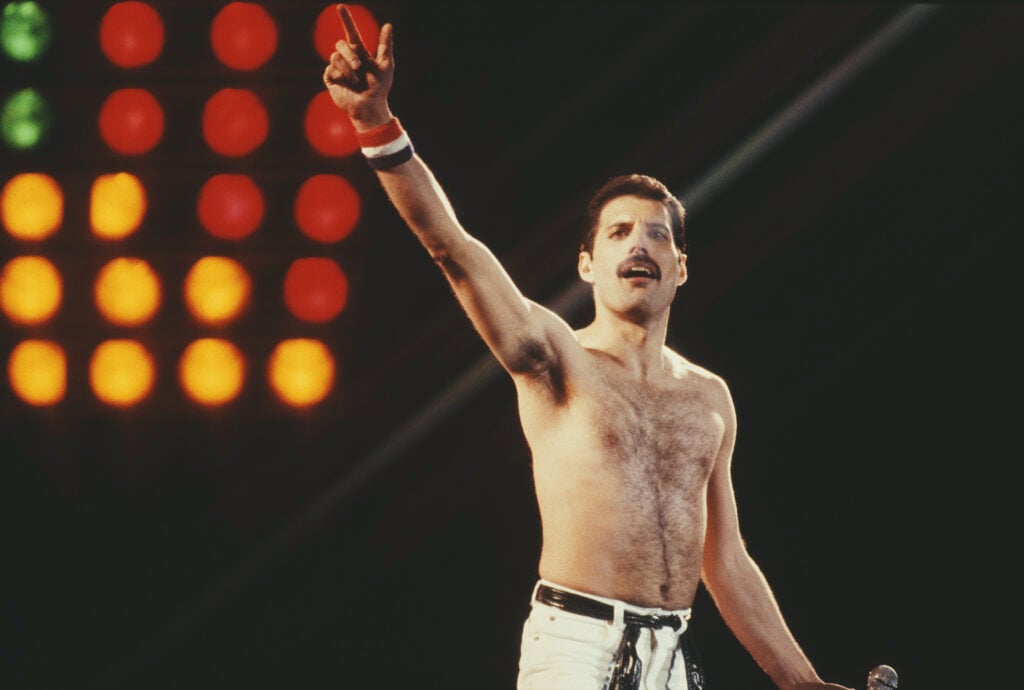 British singer Freddie Mercury (1946 - 1991) of rock band Queen in concert at Leeds Football Club, UK, 29th May 1982.