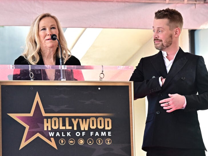 US actor Macaulay Culkin looks on as Canadian-US actress Catherine O'Hara speaks during his Hollywood Walk of Fame Star ceremony in Hollywood, California, on December 1, 2023.