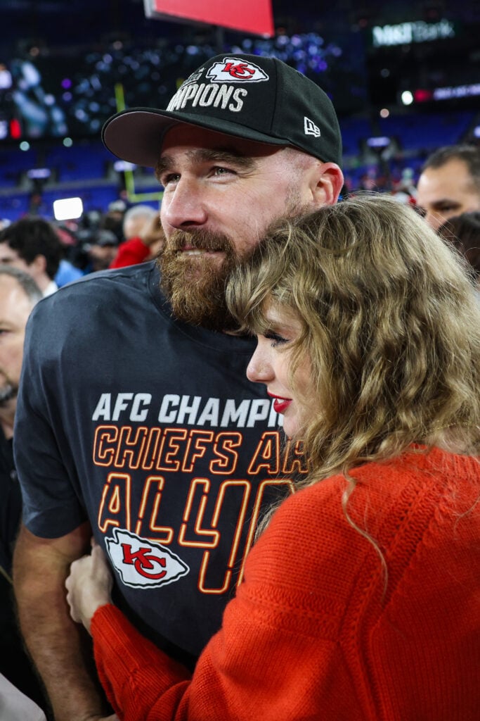 Travis Kelce #87 of the Kansas City Chiefs (L) celebrates with Taylor Swift after defeating the Baltimore Ravens in the AFC Championship Game at M&T Bank Stadium on January 28, 2024 in Baltimore, Maryland.