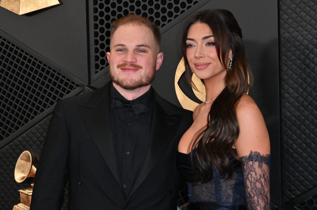 US country musician Zach Bryan and girlfriend Brianna Chickenfry arrives for the 66th Annual Grammy Awards at the Crypto.com Arena in Los Angeles on February 4, 2024.
