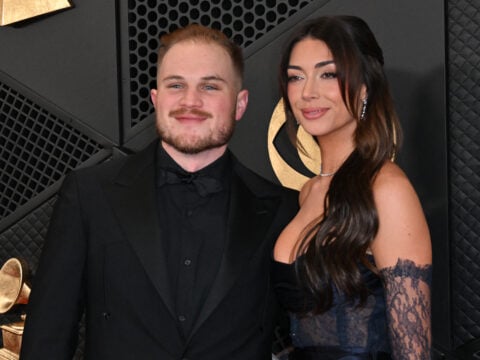 US country musician Zach Bryan and girlfriend Brianna Chickenfry arrives for the 66th Annual Grammy Awards at the Crypto.com Arena in Los Angeles on February 4, 2024.