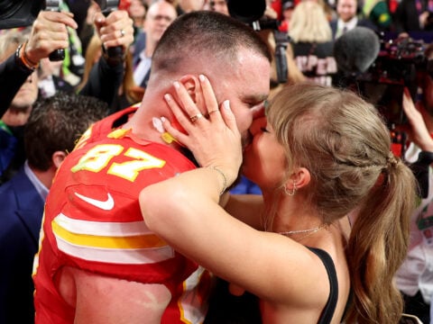 Travis Kelce #87 of the Kansas City Chiefs kisses Taylor Swift after defeating the San Francisco 49ers 25-22 in overtime during Super Bowl LVIII at Allegiant Stadium on February 11, 2024 in Las Vegas, Nevada.