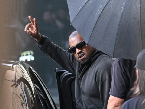US rapper and producer Kanye West gestures upon arriving at Shanghai Pudong International Airport on July 11, 2025. Kanye West will hold a concert in Shanghai on July 12.