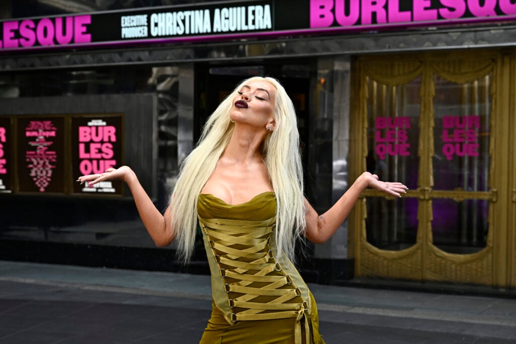Christina Aguilera attends a photocall for "Burlesque: The Musical" at The Savoy Theatre on July 21, 2025 in London, England. 
