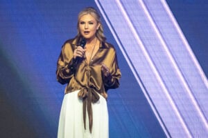 CEO and Chair of the Board of Turning Point USA Erika Kirk speaks at the Turning Point's annual AmericaFest conference, in remembrance of late right-wing political activist Charlie Kirk, in Phoenix, Arizona on December 21, 2025.