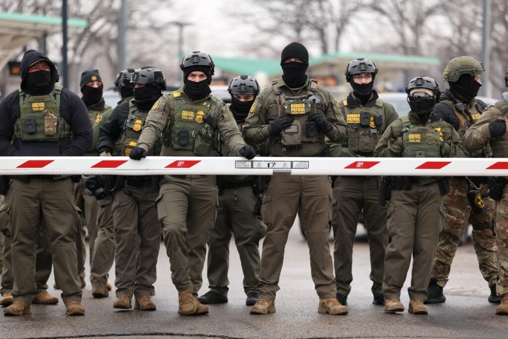 US Border Patrol agents stand guard at the Bishop Henry Whipple Federal Building in Minneapolis, Minnesota, on January 8, 2026.