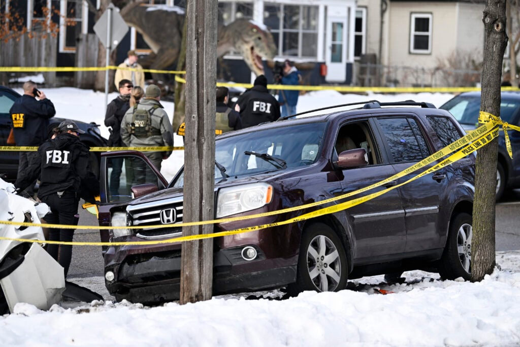 Members of law enforcement work the scene following a suspected shooting by an ICE agent during federal law enforcement operations on January 07, 2026 in Minneapolis, Minnesota.