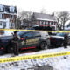 Members of the Hennepin County Sheriff's Office look on as people gather near the scene of a suspected shooting by an ICE agent during federal law enforcement operations on January 07, 2026 in Minneapolis, Minnesota.