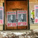 Businesses boarded up in parts of Minneapolis display posters of Renee Nicole Good on plywood-covered windows following her fatal shooting by an ICE agent, in Minneapolis, Minnesota, on January 11, 2026.