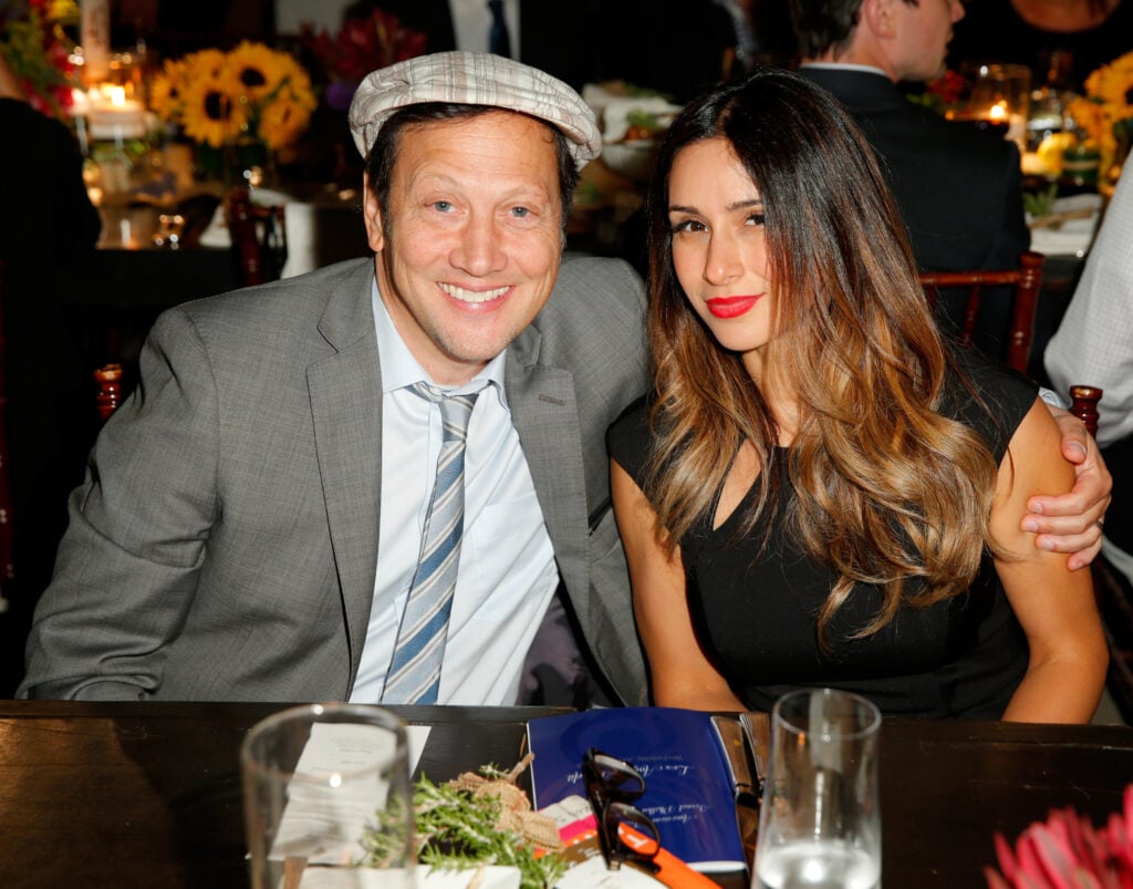Actor Rob Schneider (L) and Patricia Maya Schneider attend American Friends Of The Israel Philharmonic Orchestra Benefit Honoring Hans Zimmer at Wallis Annenberg Center for the Performing Arts on July 16, 2014 in Beverly Hills, California.