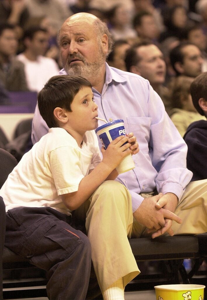 Director Rob Reiner and his son watch a game between the San Antonio Spurs and the Los Angeles Lakers March 9, 2001 in Los Angeles, CA.