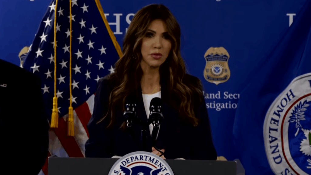 Kristi Noem at the podium.