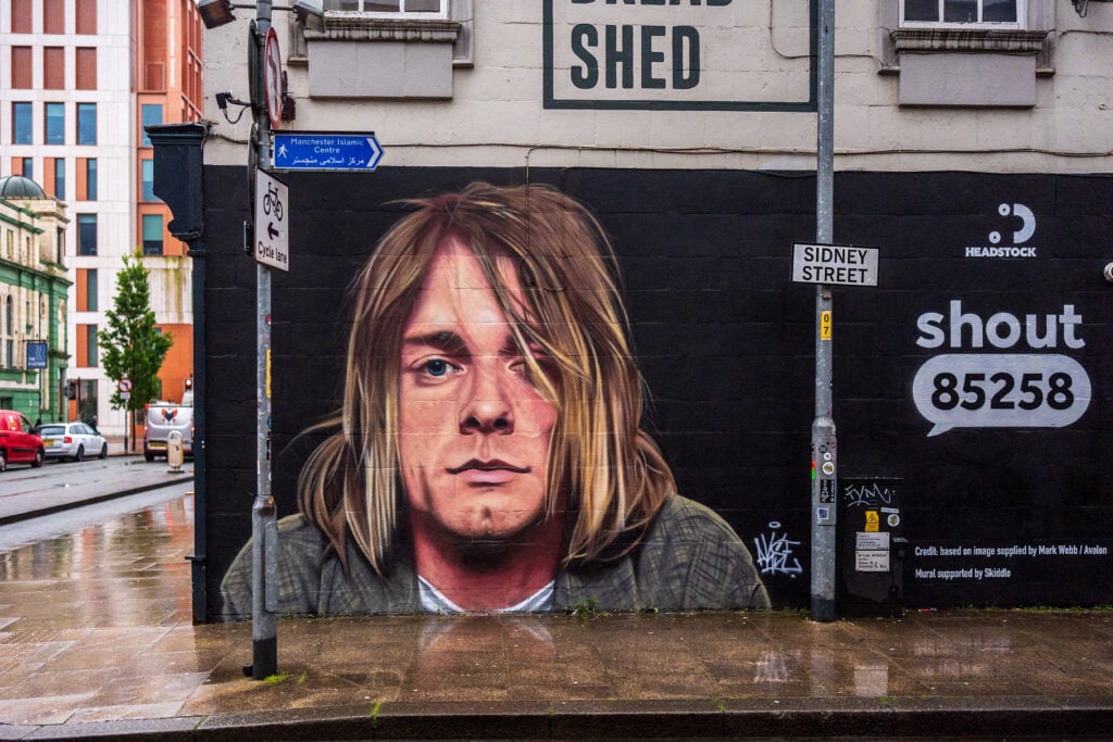 A new mural of Kurt Cobain is displayed on the side of of The Bread Shed music venue on May 23, 2024 in Manchester, England.  