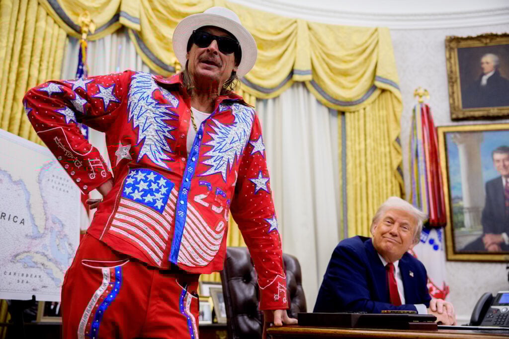 U.S. President Donald Trump listens as entertainer Kid Rock speaks during an executive order signing event in the Oval Office of the White House on March 31, 2025 in Washington, DC.