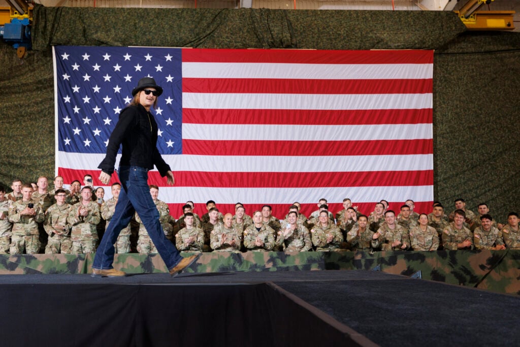 Musician Kid Rock introduces U.S. Vice President JD Vance to speak in front of members of the US Military on November 26, 2025 in Fort Campbell, Kentucky. 