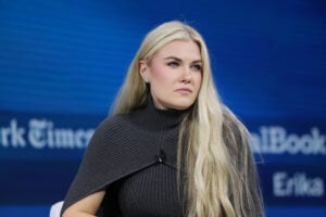 C.E.O. and Chair of the Board of Turning Point USA Erika Kirk sits silently onstage during the 2025 New York Times Dealbook Summit at Jazz at Lincoln Center on December 03, 2025 in New York City.