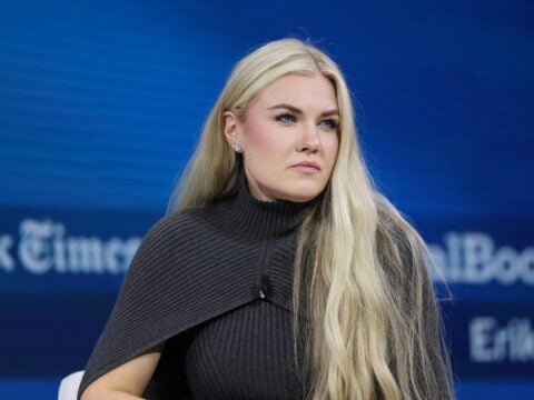 C.E.O. and Chair of the Board of Turning Point USA Erika Kirk sits silently onstage during the 2025 New York Times Dealbook Summit at Jazz at Lincoln Center on December 03, 2025 in New York City.