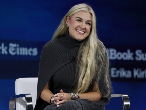 C.E.O. and Chair of the Board of Turning Point USA Erika Kirk sits silently onstage during the 2025 New York Times Dealbook Summit at Jazz at Lincoln Center on December 03, 2025 in New York City.