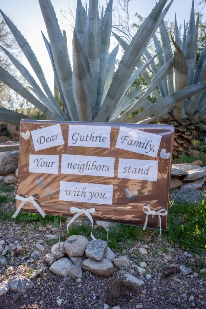 A sign is posted at the house of Nancy Guthrie, NBC host Savannah Guthrie's mother, on February 3, 2026 in Catalina, Arizona. 