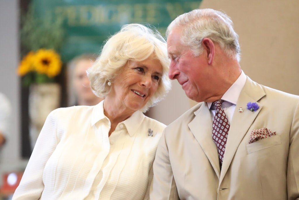 Prince Charles, Prince of Wales and Camilla, Duchess of Cornwall look at eachother as they reopen the newly-renovated Edwardian community hall The Strand Hall during day three of a visit to Wales on July 4, 2018 in Builth Wells, Wales. 