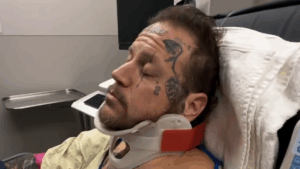 Jelly Roll in a neck brace in a hospital bed in January 2026.