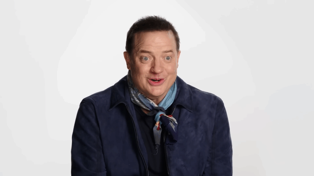 Brendan Fraser in front of a blank void.