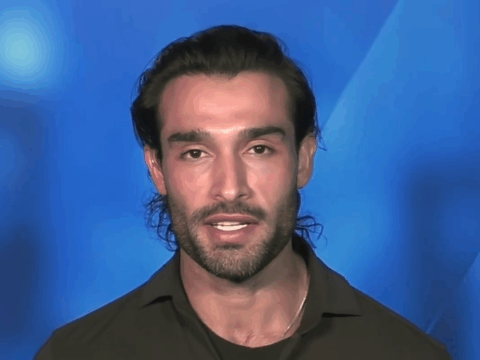 Sam Asghari speaks in from of a blue screen.