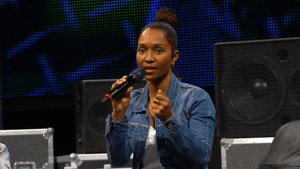 Rozonda "Chilli" Thomas speaks on a stage