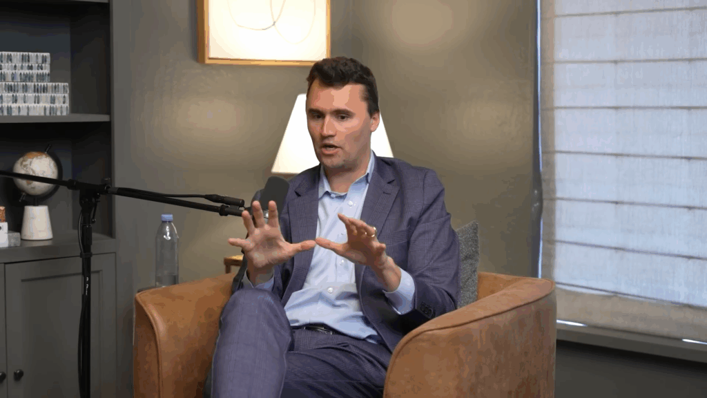 Charlie Kirk gestures while speaking.