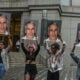 A protest group called "Hot Mess" hold up signs of Jeffrey Epstein in front of the Federal courthouse on July 8, 2019 in New York City.