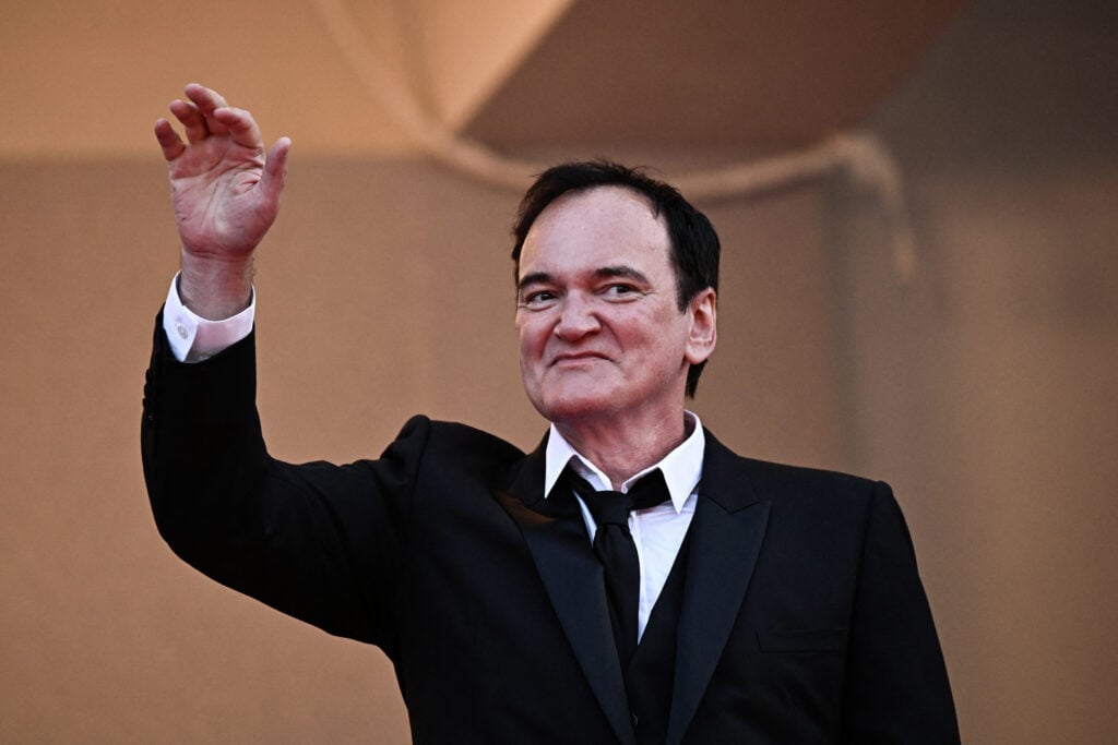 US director Quentin Tarantino waves as he arrives for the Closing Ceremony and the screening of the film "Elemental" during the 76th edition of the Cannes Film Festival in Cannes, southern France, on May 27, 2023. 