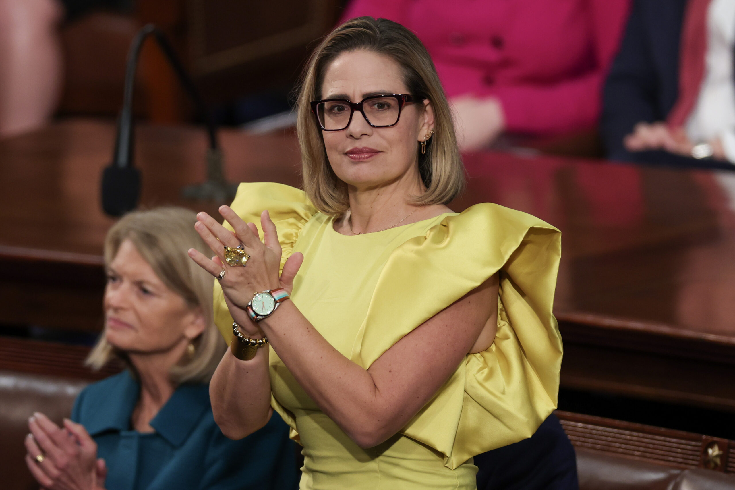 US Senator Kyrsten Sinema (R-Arizona) applauds during US President Joe Biden's State of the Union address during a joint meeting of Congress in the House Chamber of the US Capitol on February 07, 2023 in Washington, DC. 