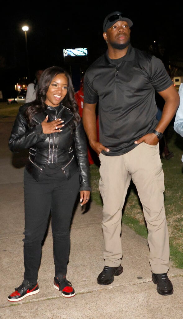 Rep. Jasmine Crockett (D-TX) with security guard known as Mike King and later identified as 39-year-old Diamon-Mazairre Robinson, greets supporters on February 27, 2026 in Dallas, Texas. 