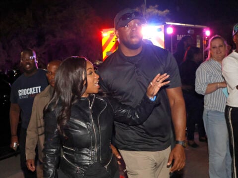 Rep. Jasmine Crockett (D-TX) with security guard known as Mike King and later identified as 39-year-old Diamon-Mazairre Robinson, arrives to greet supporters on February 27, 2026 in Dallas, Texas.