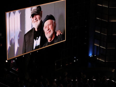 A screen shows a photo of late US director Rob Reiner and US actor Billy Crystal during the 98th Annual Academy Awards at the Dolby Theatre in Hollywood, California on March 15, 2026.