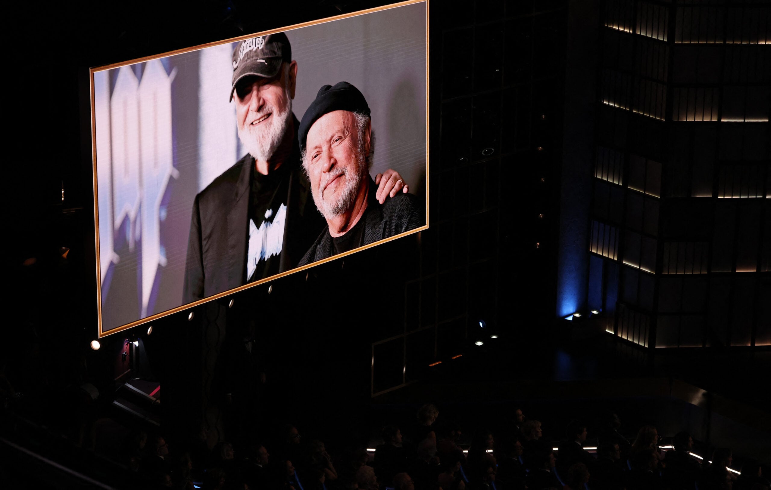A screen shows a photo of late US director Rob Reiner and US actor Billy Crystal during the 98th Annual Academy Awards at the Dolby Theatre in Hollywood, California on March 15, 2026.