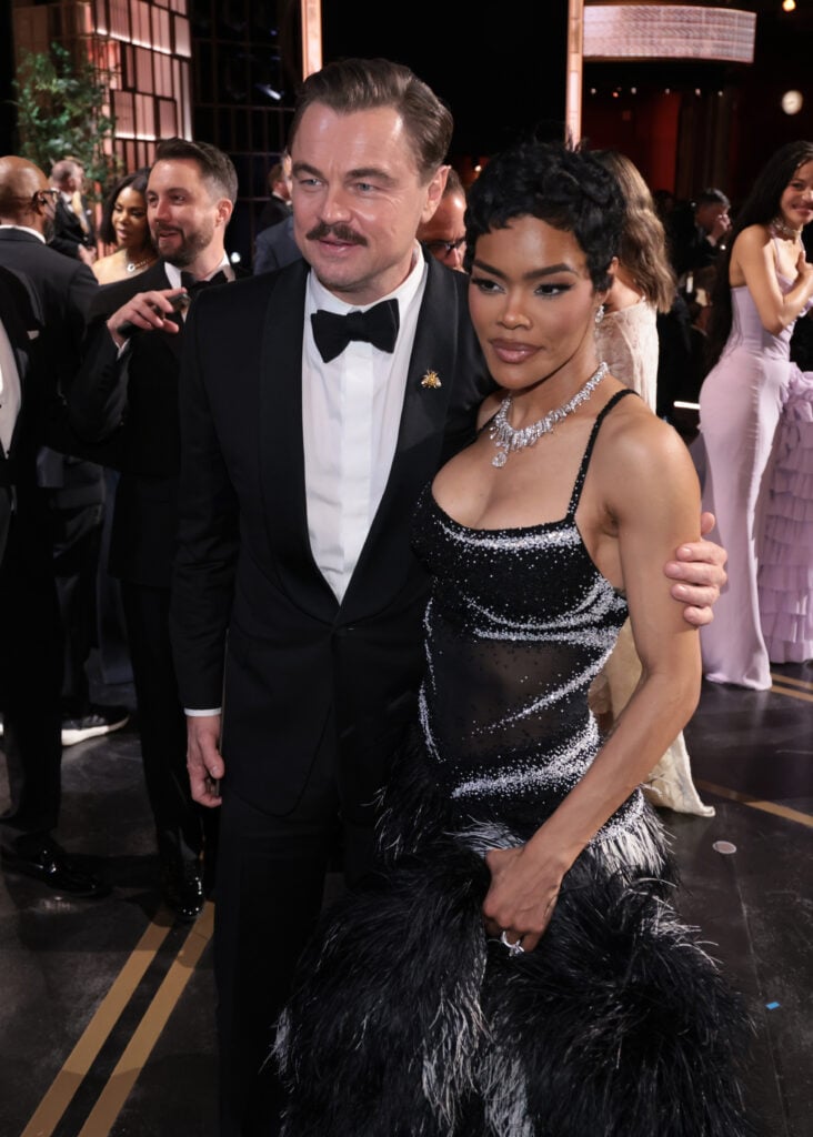 In this handout photo provided by The Academy, Leonardo DiCaprio and Teyana Taylor pose onstage after winning the award for Best Picture for "One Battle After Another" during the 98th Oscars at Dolby Theatre on March 15, 2026 in Hollywood, California. 